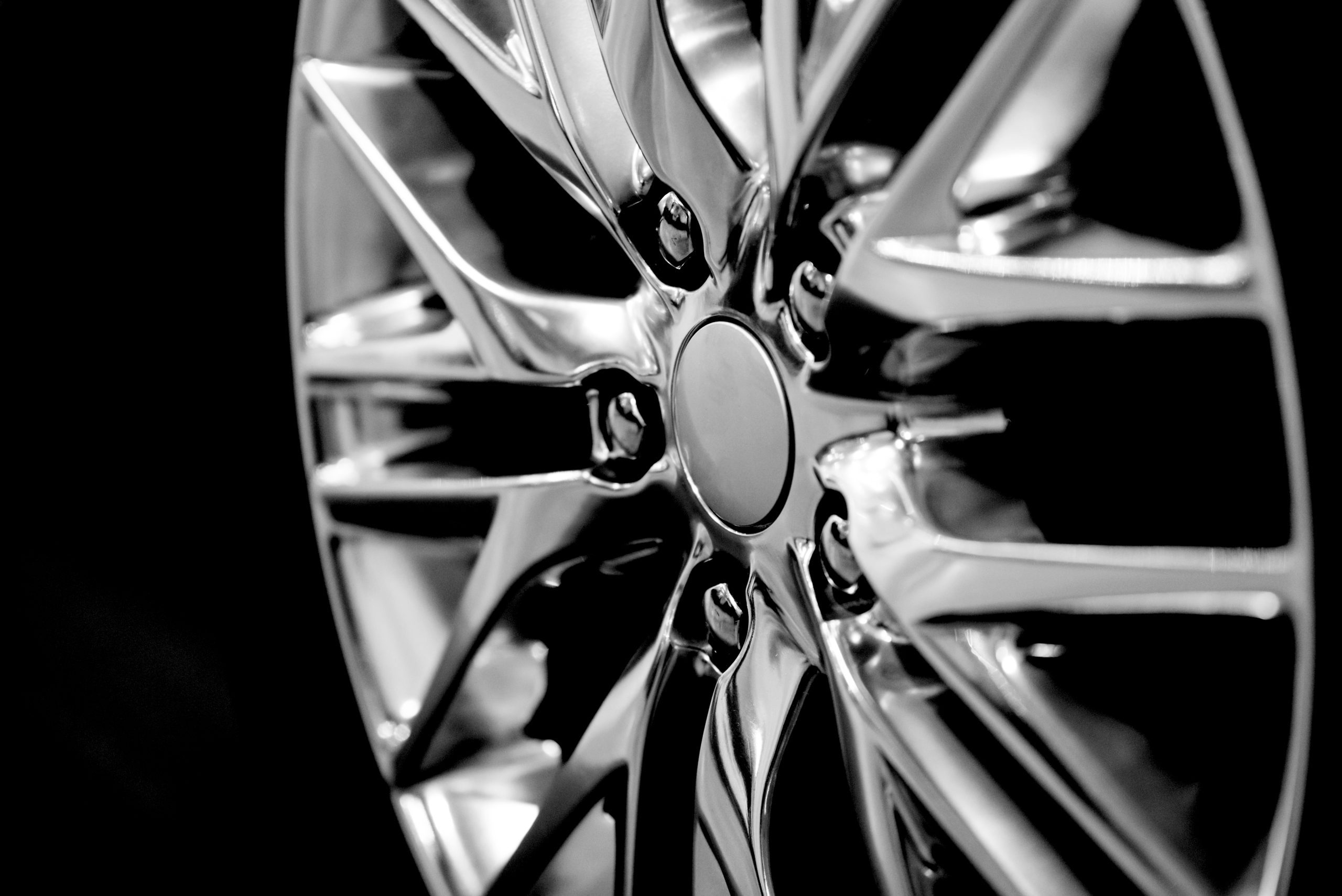 Luxury,Chrome,Alloy,Wheel,In,Close-up,As,An,Automotive,Background